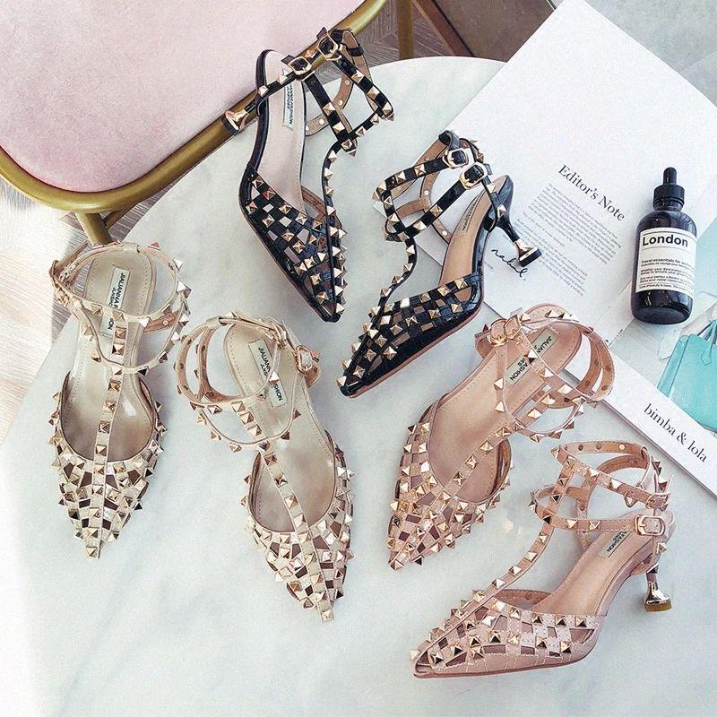 High heel female rivets summer thin heel pointed sandals feminine all-match Europe and America